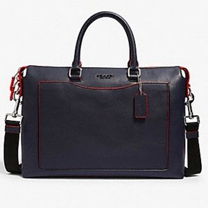 COACH BECKETT POCKET BRIEF
NAVY/MIAMI RED